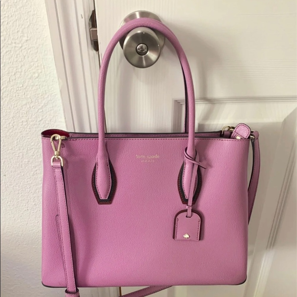 Purple Kate Spade satchel with crossbody strap